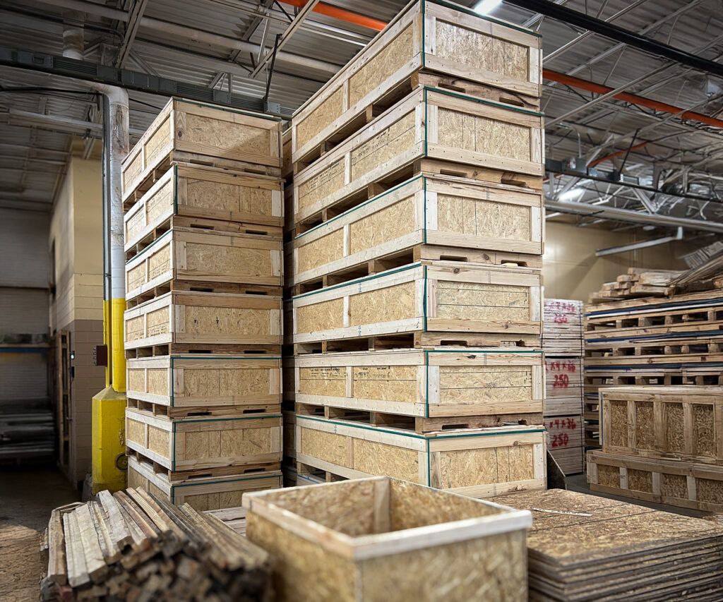 Warehouse stacked with finished custom wood shipping crates ready for freight